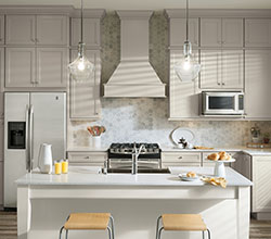 Aristokraft Cabinetry Two Tone Durham Kitchen With Gray Cabinets And A White Island, Wood Purestyle Laminate, Finish: Glacier Gray, Purestyle Cabinet Moulding